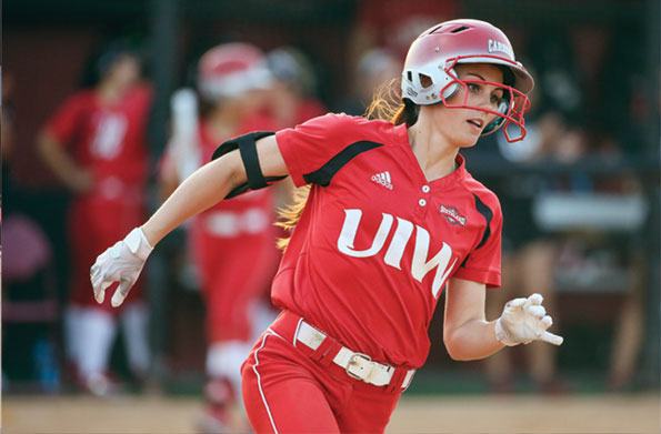 Female softball player running